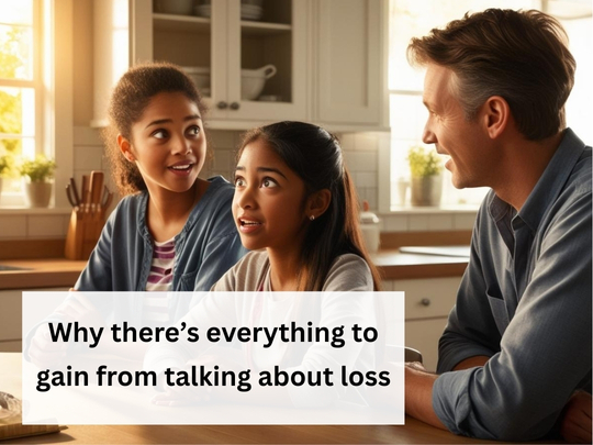 Two mixed-race children at breakfast bar with white adult engaged in conversation with one another. Black sentence case text in white box reads: 'Why there's everything to gain from talking about loss.'